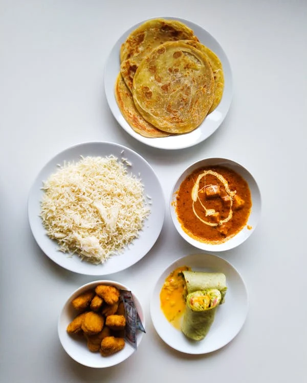 White Qorma with naan or basmati rice on the side for a family style setting.