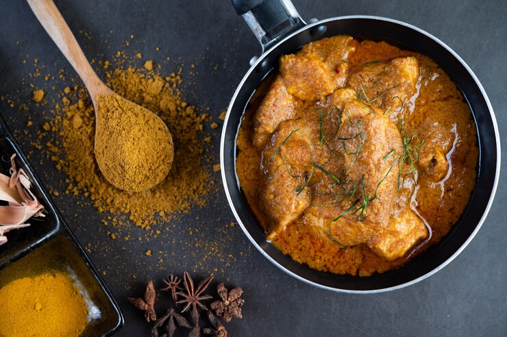 Lahori Murgh Chana simmering in a pot showcasing the rich colors of the masala